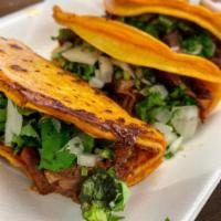 Taco de Birria  · Tijuana Style Birria (beef) taco, Onions, Cilantro, Red Salsa