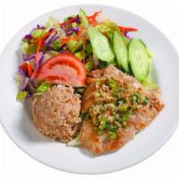 Healthy Garlic Fish Plate · A mouthwatering mahi filet seasoned with garlic. Served with brown rice and tossed salad.