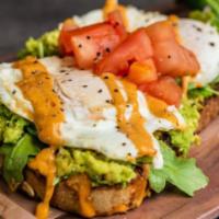 Avocado Toast Egg Platter · 2 over-easy cage-free eggs, avocado, arugula, tomatoes & secret 