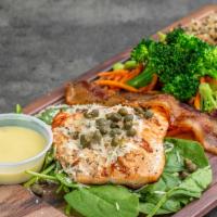 Herbed Salmon Platter · wild Alaskan Sustainable Salmon served over a bed of spinach with fresh herbs, capers, peppe...