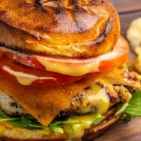 Grilled Chicken Sandwich · grilled chicken breast, Cheddar cheese, arugula, tomatoes & honey mustard on a toasted brioc...