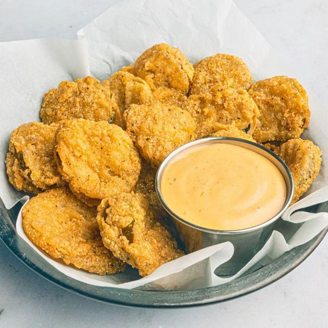 Fried Pickles · Super addictive! Lightly fried pickle slices served with our signature cyclone sauce for dipping. (1030 cal.)