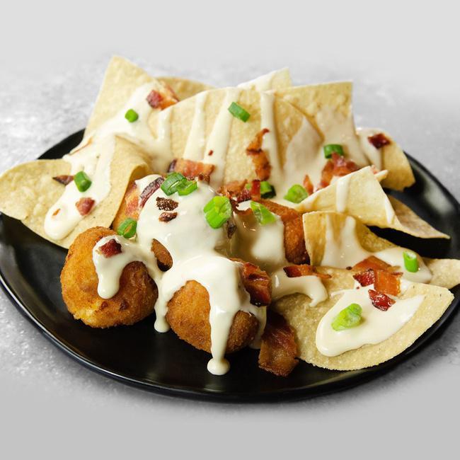 Mac N' Cheese Bites · These crispy bites are stuffed with applewood bacon and macaroni with American cheese and New York cheddar cheese, fried to golden perfection. Topped with queso and bacon crumbles, served with tortilla chips. (980 cal.)