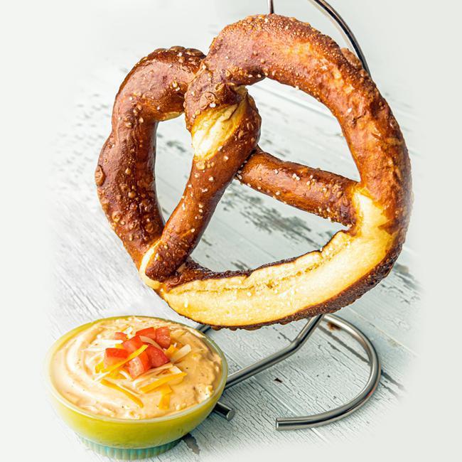 Bavarian Pretzel and Beer Cheese Dip · Jumbo soft pretzel, crispy brown on the outside and fluffy on the inside. Perfectly paired with our famous beer cheese. (1920 cal)