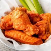 10 Wings · 10 Jumbo Bone-In Wings tossed in your choice of up to 2 sauces.  Served with celery and ranc...