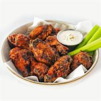 Gridiron Wings · Marinated in flavor and heat, these 10 chicken wings are crispy-skinned from a rub of Cajun ...