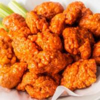 15 Boneless · 15 Boneless Wings tossed in your choice of up to 2 sauces.  Served with celery and ranch or ...