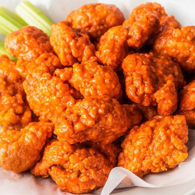 15 Boneless · 15 Boneless Wings tossed in your choice of up to 2 sauces.  Served with celery and ranch or bleu cheese dressing for dipping.  (1950-3060 cal)