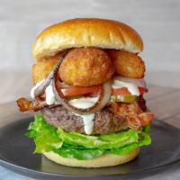 MacDaddy Burger · A signature all-beef patty, topped with fried mac n cheese bites, grilled onions, crispy bac...