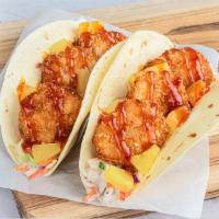 Coconut Shrimp Tiki Taco · Our popular coconut crusted jumbo shrimp is paired with diced pineapple on a bed of tangy co...