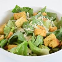 Side Caesar Side Salad · Crisp chopped Romaine lettuce tossed in creamy Caesar dressing, topped with croutons and Par...