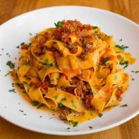 Pappardelle alla bolognese · Tomato meat sauce (ragu') - Egg noodle pasta