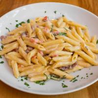 Penne Cividale · Diced Prosciutto crudo, cream, rosemary, diced tomatoes, grated Parmesan cheese