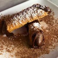 Cannoli · Cannoli filled with sweet creamy ricotta, with a hint of chocolate. 