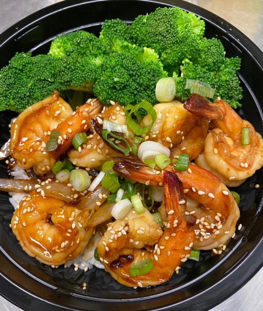 Ebi Teriyaki · Stir-fried Shrimps with caramelized onion teriyaki sauce topped with green onion, sesame seeds. Served over Japanese steamed white rice and steamed broccoli