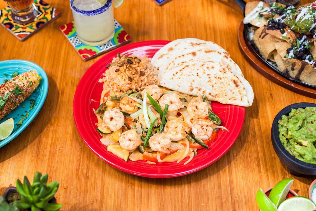 Spicy Cantina Camarones  · Shrimp. 8 pieces tiger shrimp sauteed with pineapple in a coconut milk and santaka pepper sauce. Served with a side of flour tortillas. Spicy.