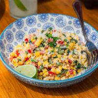 Esquites · Esquites our award winning grilled sweet corn, pablano peppers and red peppers mixed with ma...