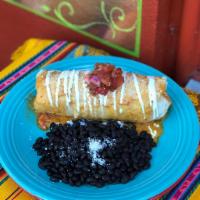 Mission Burrito · Stuffed with red rice, sauteed veggies, shredded cheese and your choice of filling. Topped w...