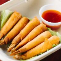 A4. Shrimp in a Blanket · 6 piece. Lightly crisp spring rolls skin wrapped around our marinated shrimp. Served with ou...