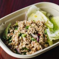 A9. Larb Wrap · Minced chicken seasoned with parched rice, red onions, cilantro, scallions and lime juice. S...