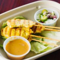 A10. Satay · Five pieces of chicken  marinated and grilled to perfection. Served with our homemade peanut...