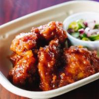 A9. Chicken Wing (Boneless)  in Red Wine · 6 piece. Deep fried chicken wing marinated in chili and red wine sauce. Spicy.