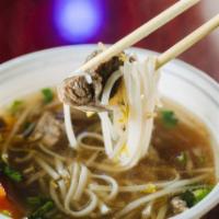 P3. Beef Stew Noodle Soup · Beef stew soup with pad Thai noodles, bean sprouts, broccoli, scallions, cilantro and a touc...