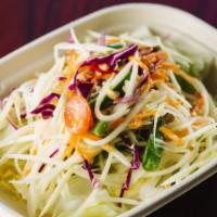 S2 Papaya Salad · Traditional Thai salad of shredded green papaya, carrots, chili, crushed peppers, tomatoes, ...