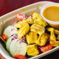 S3. Satay Salad · Chicken marinated in special spices on a bed of mixed greens. Served with our homemade peanu...