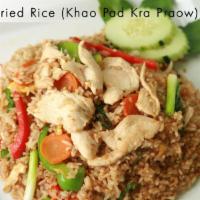 F3. Basil Fried Rice · Khao pad kra praow. Jasmine rice stir fried with chicken or beef in garlic chili sauce with ...