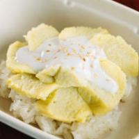 W1. Custard and Sticky Rice · Our sweet sticky rice with coconut milk is topped with a sweet golden custard concoction.