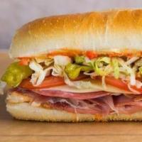 Torpedo Sandwich · Ham, salami, mortadella, provolone, tomatoes, onions, lettuce, pepperoncini and Italian dres...