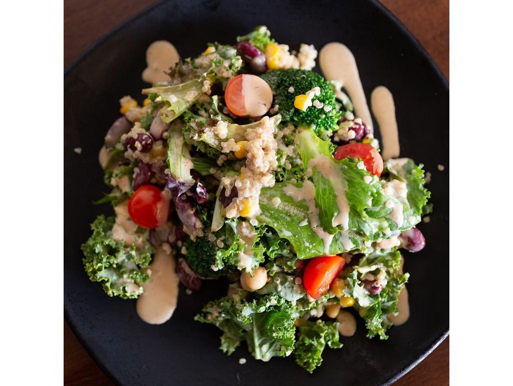 Jinya Quinoa Salad · Baby greens, kale, broccoli, white quinoa, kidney beans and garbanzo beans tossed with sesame dressing, garnished with corn and cherry tomatoes. Vegetarian.