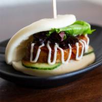 JINYA Bun · Steamed bun stuffed with slow braised pork chashu, cucumber and baby mixed greens served wit...