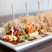 Takoyaki - Octopus Balls · Octopus balls. Battered octopus over egg tartar topped with mayonnaise, okonomiyaki sauce, f...