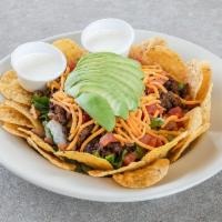 Taco Salad · Seasoned ground beef, red beans, tomato, cheddar cheese, and avocado.