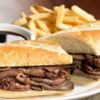 French Dip Sandwich · Thinly sliced roast beef, sauteed onions and mozzarella cheese. Served with french fries.