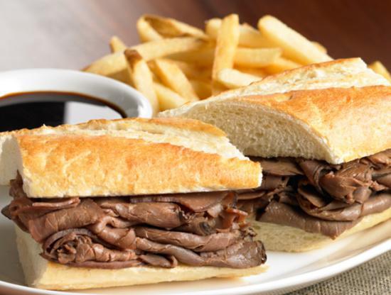 French Dip Sandwich · Thinly sliced roast beef, sauteed onions and mozzarella cheese. Served with french fries.