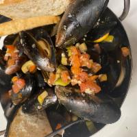 Sauteed Mussels  · Sauteed in white wine with garlic and shallots served with crostini. 