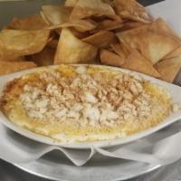 Crab Dip  · 3 different cheeses melted down to compliment our fresh jumbo lump crab meat. Baked till gol...