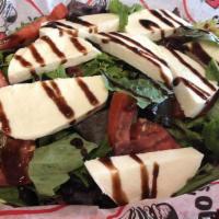 *Caprese Salad. · Sliced tomato, fresh Mozzarella cheese, and fresh basil drizzled with balsamic glaze atop or...