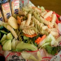 *Pasta & Green Salad · Veggie pasta salad with Italian dressing served on a large plate of green combo salad.