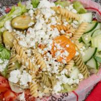*Pasta, Green, & Feta Salad · Italian vegetable pasta salad topped over a large plate of green combo salad and real Feta c...