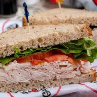 *Turkey Sandwich · Freshly cut oven-roasted turkey breast, Made-To-Order on your choice of bread, served with l...