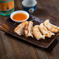 Gyoza.. · Pork, chicken and vegetable dumplings served fried or grilled with gyoza sauce