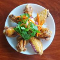 14A. Caramelized Fish Sauce Chicken Wings · Canh ga chien nuoc mam. Fried chicken wings caramelized with garlic, butter, red pepper and ...