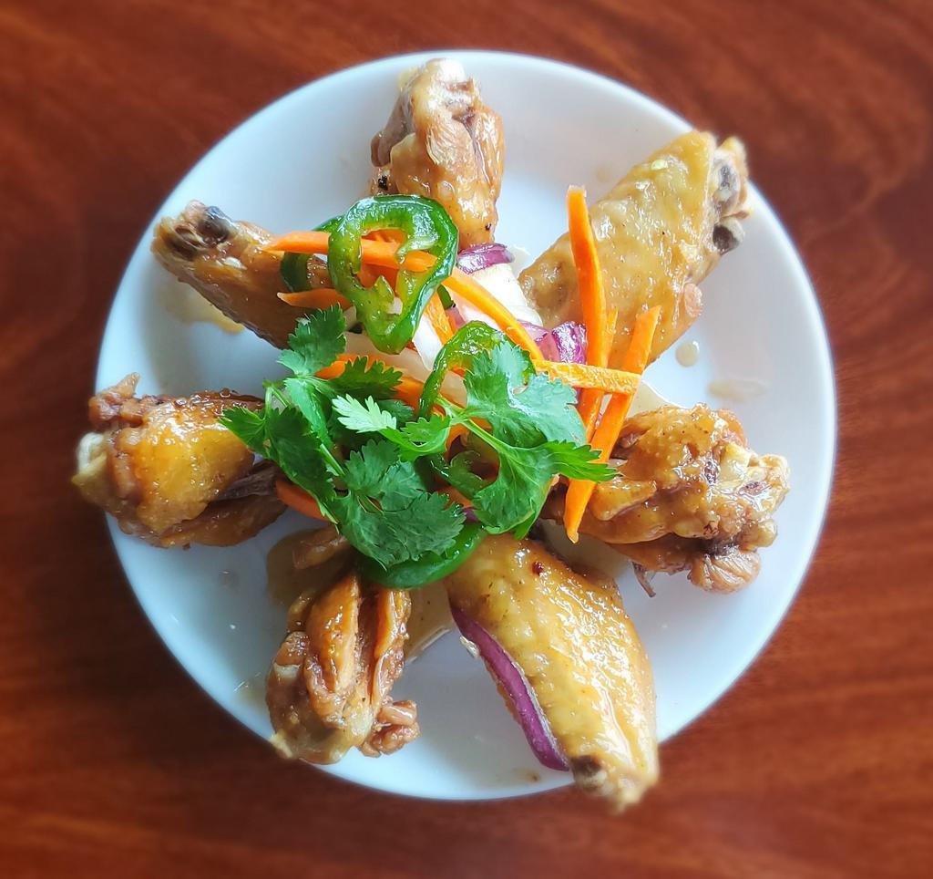 14A. Caramelized Fish Sauce Chicken Wings · Canh ga chien nuoc mam. Fried chicken wings caramelized with garlic, butter, red pepper and fish sauce.