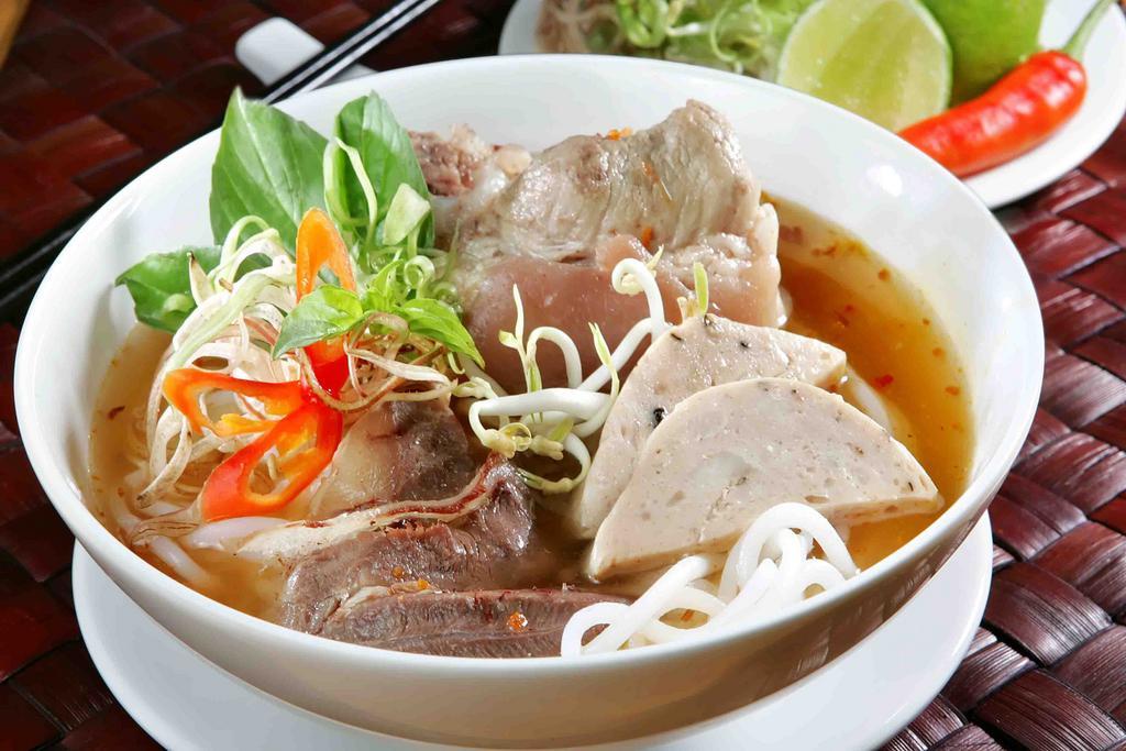 Spicy Noodles Soup/ Bun Bo Hue · Spicy noodles soup with beef shank, vietnamese meatloaf and pork blood