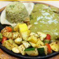 Pollo Poblano · Grilled chicken breast topped with poblano sauce. Served with cilantro lime rice and sauteed...