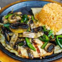 Pollo con Hongos · Grilled chicken breast topped with mushrooms, onions, and poblano peppers. Served with rice.